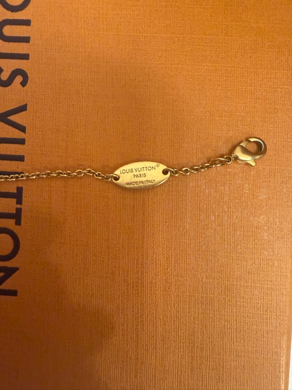 Louis Vuitton Gold-Tone LV Charm White Enamel Bracelet - Picture 5 of 6
